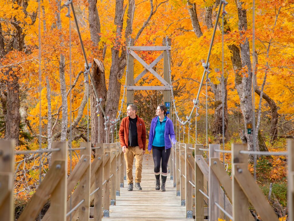 Two hikers explore Warren Lake in the Cape Breton Highlands National Park.