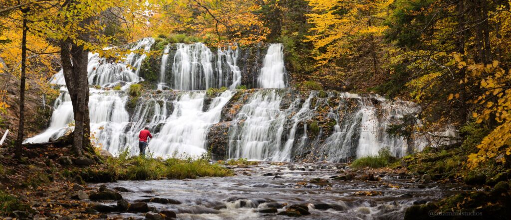 A photographer at Egypt Falls in the fall