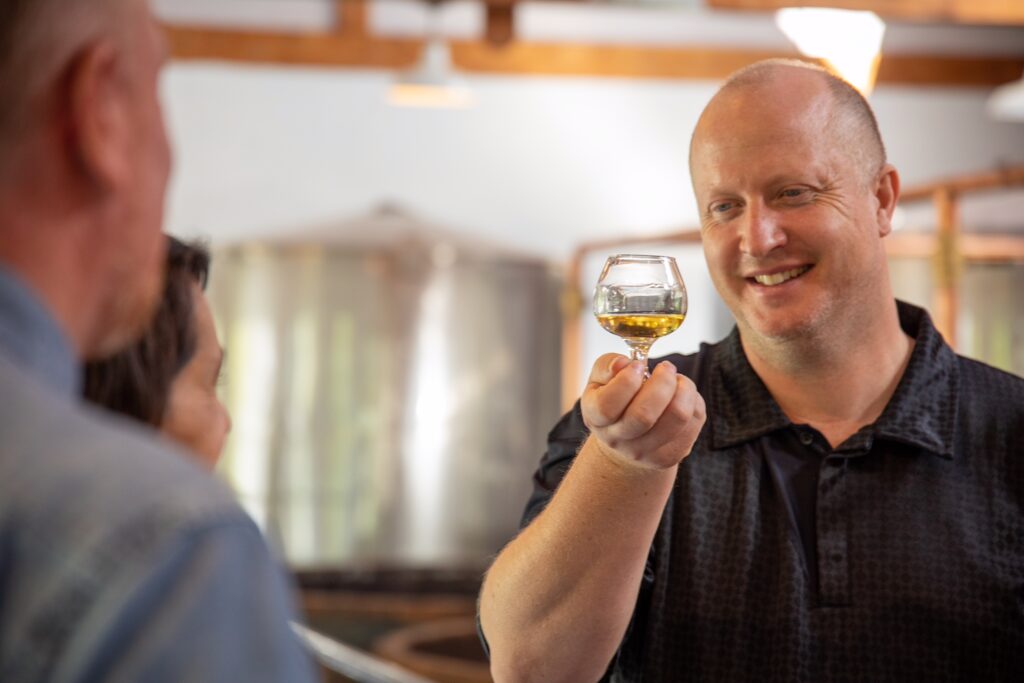 a guest admiring a glass of whisky