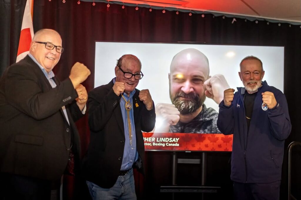 men announcing a boxing event
