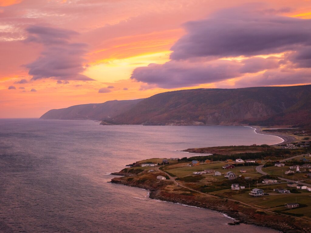 A full aerial photo of cheticamp at sunrise