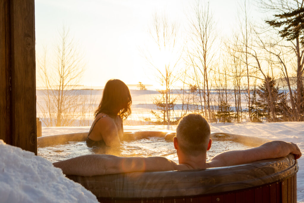 two people sitting in a hot tub