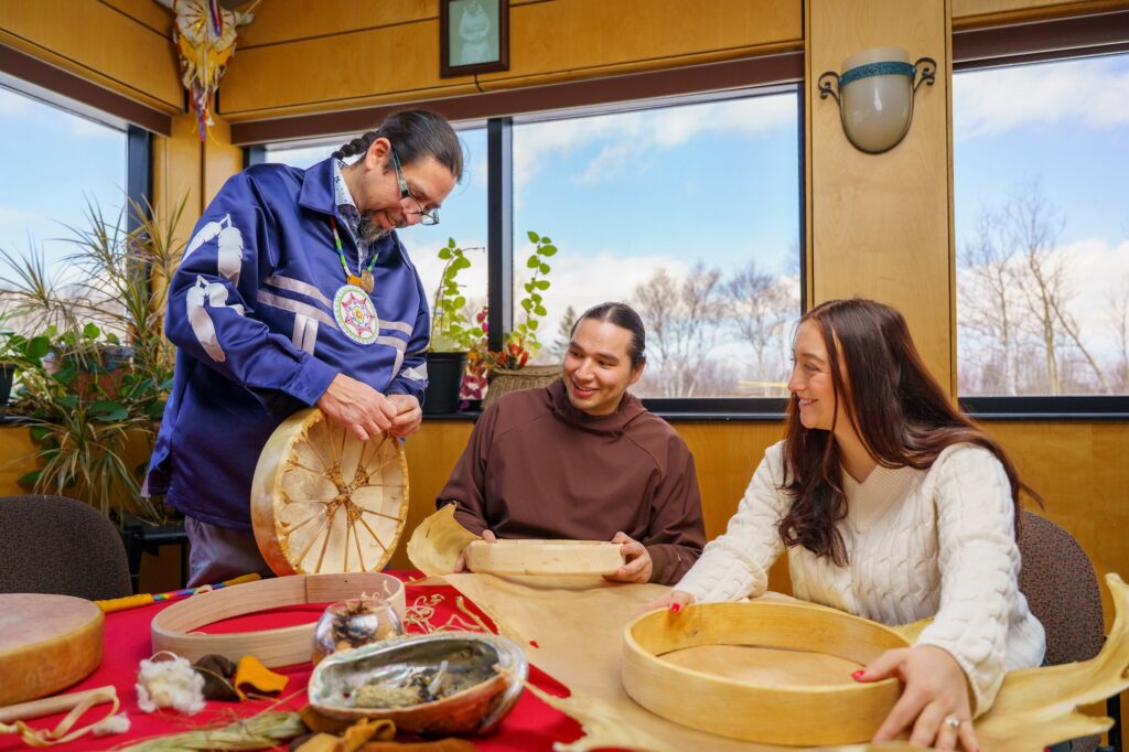 people attending an indigenous drum making workshop
